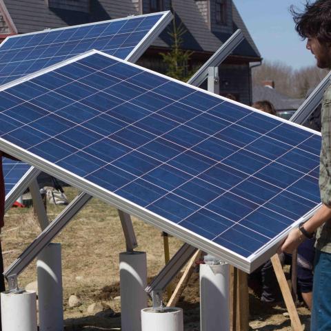 Students install a solar panel