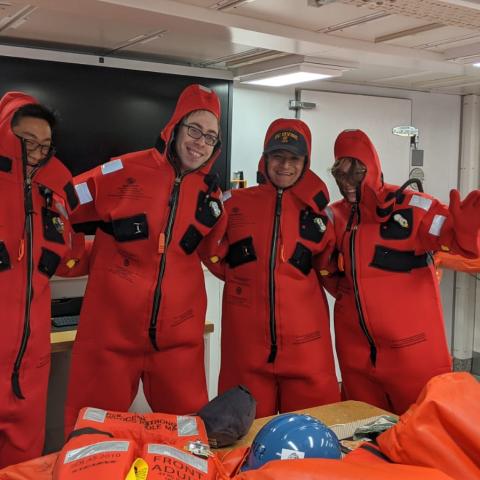 A group of people in red suits