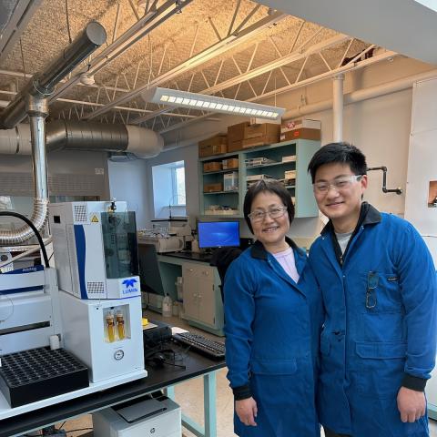 A young man and a woman in a lab