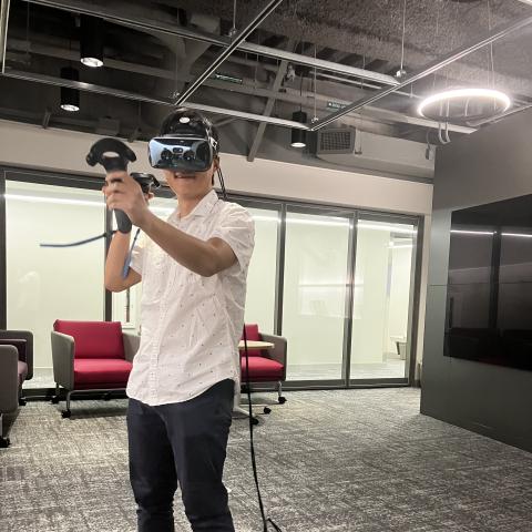 A young man wearing a VR headset.