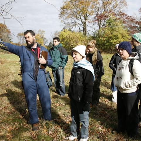 A professor leads students on a tour