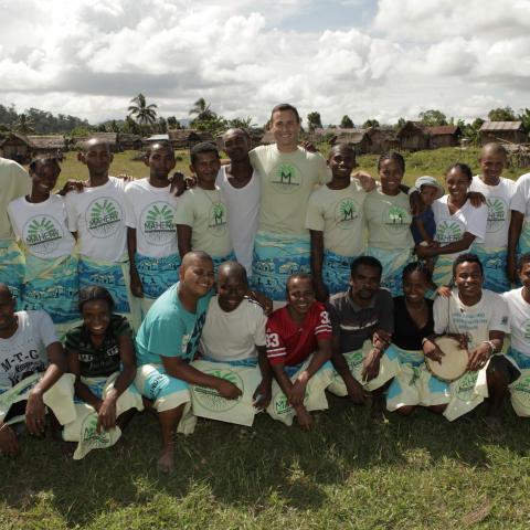 Dr. Golden and a group of researchers pose in a field in Madagascar.