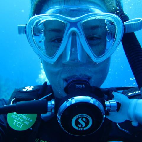 A young woman in SCUBA gear