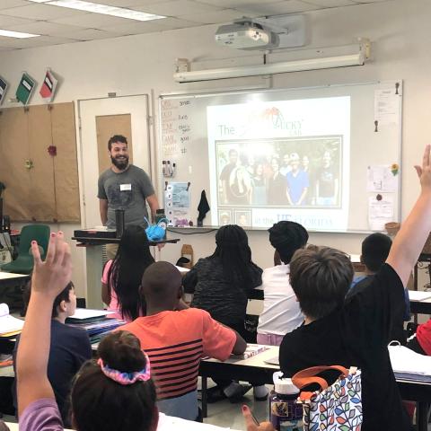 A college student teaches an elementary school class