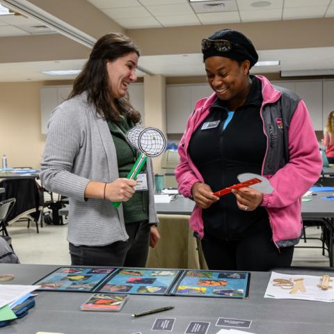 Two college students at a conference table