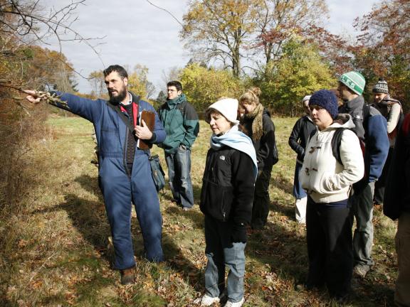 A professor leads students on a tour