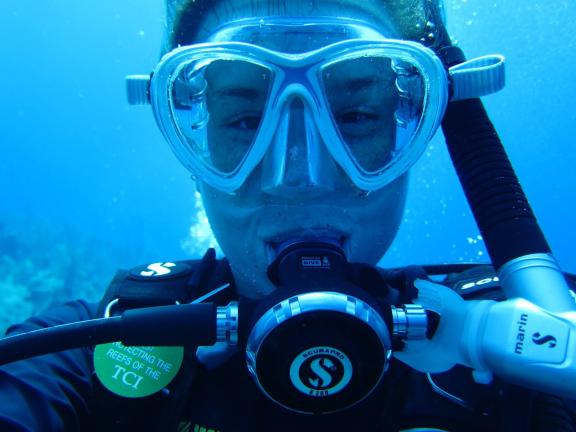 A young woman in SCUBA gear