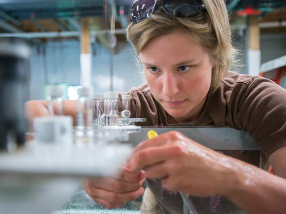 A woman conducts research in a science lab
