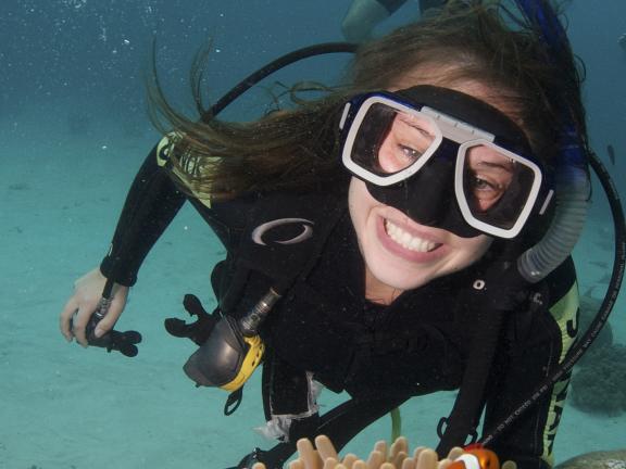 A young woman SCUBA diving