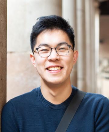 A young man in glasses