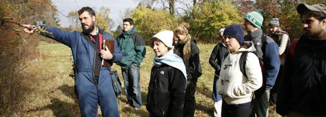 A professor leads students on a tour