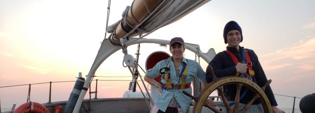 Two people on the deck of a tall ship