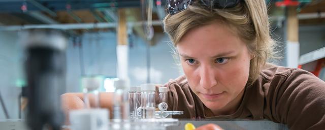 A woman conducts research in a science lab